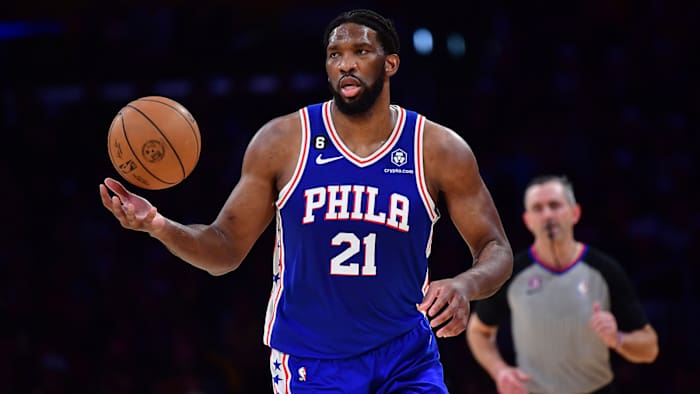Philadelphia 76ers center Joel Embiid brings the ball up court against the Los Angeles Lakers.